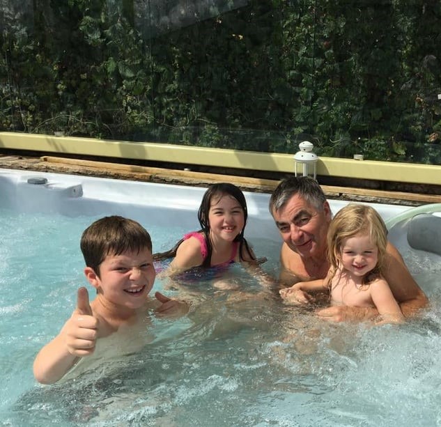 Family in a hot tub at Howgills Barn